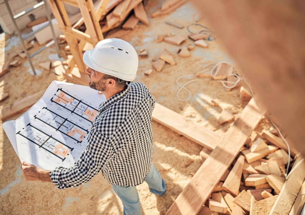 committed-builder-checking-blueprints-of-a-house-2021-09-03-21-02-48-utc